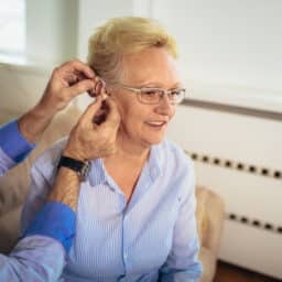 Woman is fitted with hearing aid