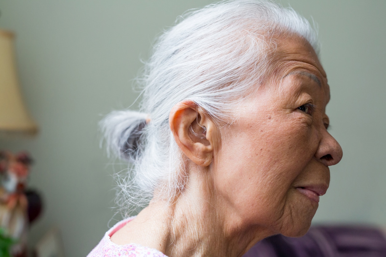 Woman wears hearing aids